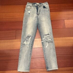 Light wash blue distressed straight-legged jeans from Cotton On
